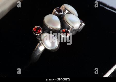 Close-up of a vintage mother-of-pearl cluster ring set in sterling silver, USA. Stock Photo