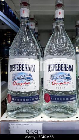 VORONEZH, Russia - April 19, 2026.Bottles of Zimnyaya Derevenka malt vodka are arranged on a shelf inside a store in Russia. The bottles feature a gla Stock Photo