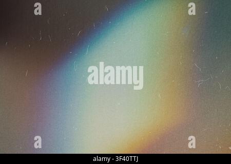 Abstract background showing colorful light leak effect with dust and grain Stock Photo