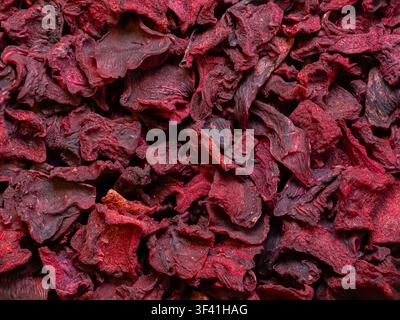 Beetroot Chips on White Plate. Color red Background Stock Photo