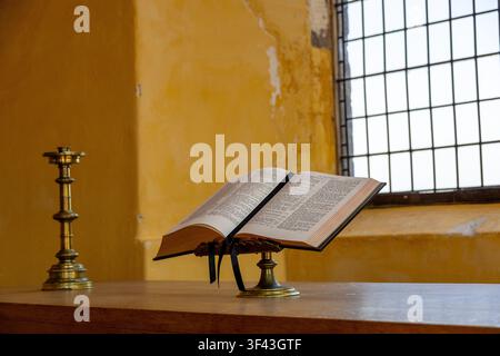 Open Bible on Altar in Historic Church Setting Stock Photo