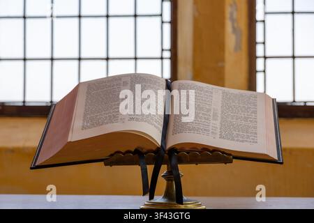 Open Bible on Altar in Historic Church Setting Stock Photo
