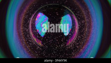 Glowing sphere. Circle neon hole. Color fantasy lens reflection light flare. Round prism frame mix swirl paint blur black background. Stock Photo