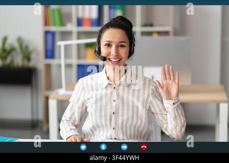 Smiling Young Asian Woman Working In Office, Using Headset, Customer Service Concept Stock Photo