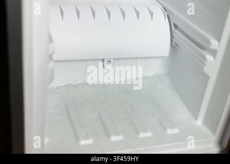 Detailed view of an empty inside of a domestic refrigerator cooling compartment Stock Photo