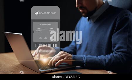 Person books a flight to Geneva from London using a laptop and prepares to download the boarding pass for the trip Stock Photo