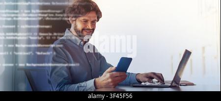 Smiling Middle Aged Caucasian Man Using Smartphone While Working At Laptop In Modern Office Stock Photo