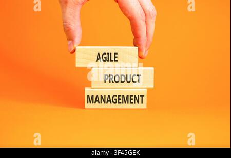 Agile product management words symbol. Concept words Agile product management on beautiful wooden blocks. Beautiful orange background. Business agile Stock Photo