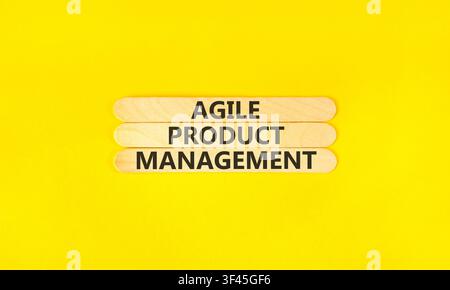 Agile product management words symbol. Concept words Agile product management on beautiful wooden sticks. Beautiful yellow background. Business agile Stock Photo