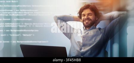 Happy Male Programmer With Brown Hair Relaxing At Desk, Office Environment, Business Concept Stock Photo