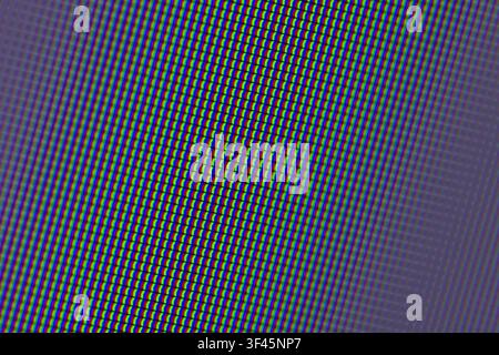 Macro close-up of an RGB pixel pattern on an electronic display showing repeating rows of red, green and blue subpixels. Abstract digital texture conv Stock Photo