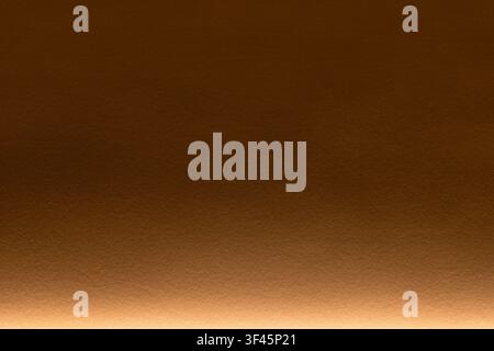 Warm brown gradient paper wall texture with bottom illumination, ideal as a background for packaging, web design, print layouts, and elegant branding Stock Photo
