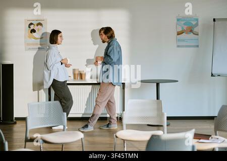 Young Adult Man and Woman Talking during Support Group Therapy Session Stock Photo
