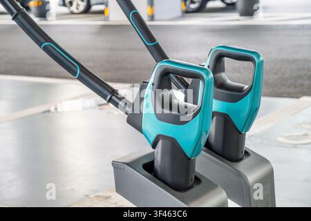 Close up of electric vehicle charging connectors at public charging station. Modern charging technology for clean transportation, renewable energy Stock Photo