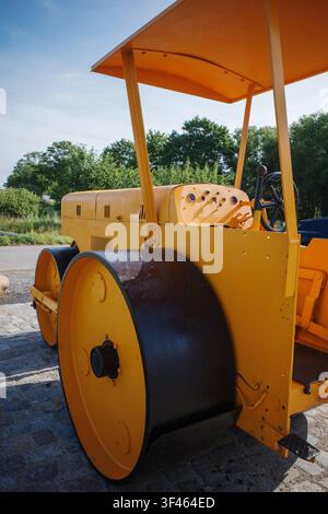 An old yellow historic levelling roller *** An old, yellow, historic grading roller  RECORD DATE NOT STATED Stock Photo