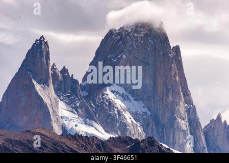 Dramatic Mountain Peaks with Snow and Clouds in Mountainous Landscape Stock Photo
