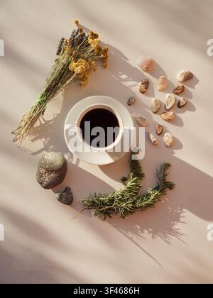 Espresso, stones, shells and wildflowers, flat lay Stock Photo