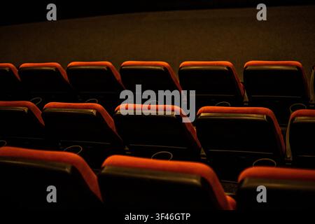 Empty red soft seats in the cinema after watching a film Stock Photo