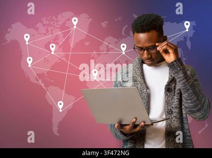 Black hacker holding laptop with virtual display server data Stock Photo