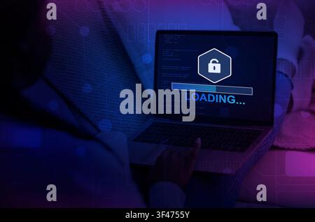 Unrecognizable hacker using laptop with progress loading bar Stock Photo