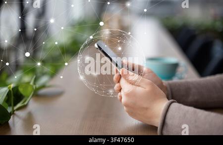 Woman using smaty phone with flying network Stock Photo