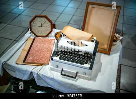 Vintage Typewriter with Octagonal Clock, Ledger, and Blank Picture Frame Stock Photo