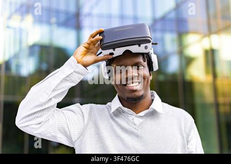 Man Wearing VR Headset Outdoors Stock Photo
