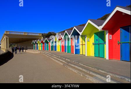 Colourful, painted wooden beach huts at Barry Island seaside resort, South Wales, UK Stock Photo