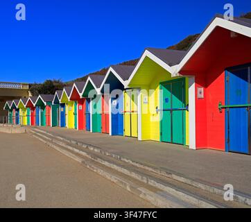 Colourful, painted wooden beach huts at Barry Island seaside resort, South Wales, UK Stock Photo