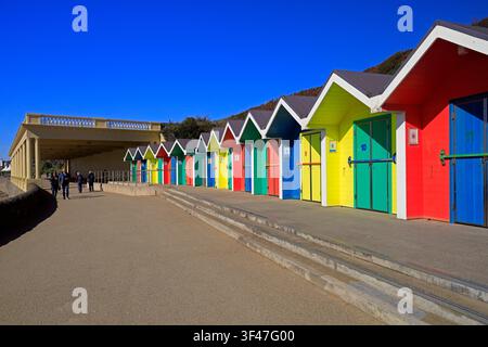Colourful, painted wooden beach huts at Barry Island seaside resort, South Wales, UK Stock Photo