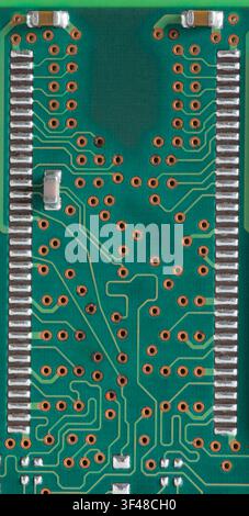 Complicated connections on the back of a computer RAM card. Stock Photo