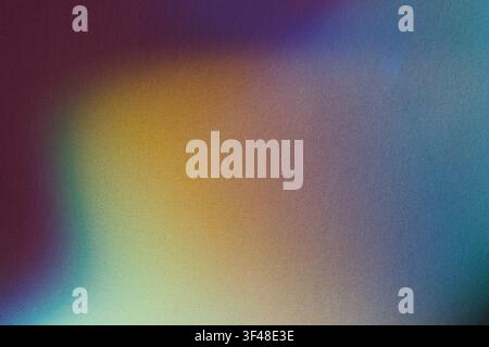 Abstract background showing blurred color gradients with subtle texture and noise overlay Stock Photo