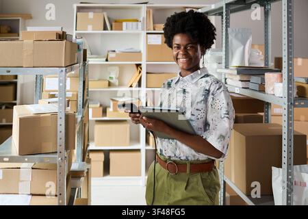 Portrait of Black Woman Scanning Inventory in Small Business Warehouse Stock Photo