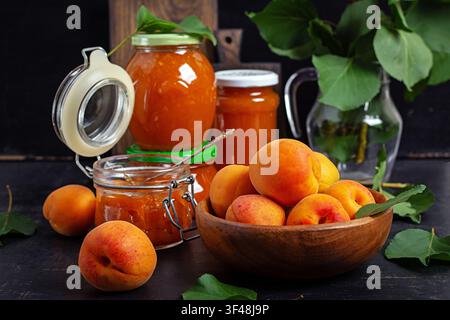 Homemade Apricot Jam in Glass Jars with Fresh Apricots Stock Photo
