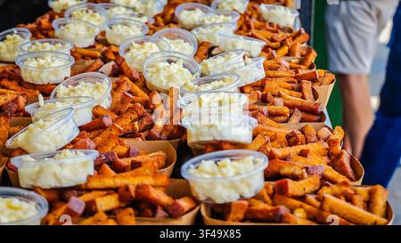 Traditional Lithuanian fried white bread with creamy cheese sauce, a popular Baltic beer snack served as authentic pub food and comfort cuisine. Deep Stock Photo