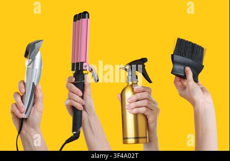 Hairdressers holding different tools in hands on orange background, set Stock Photo