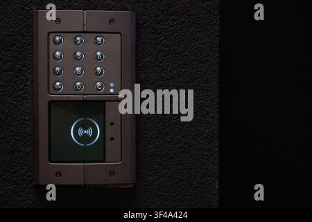 Modern video intercom with keypad and RFID access control on residential building entrance Stock Photo