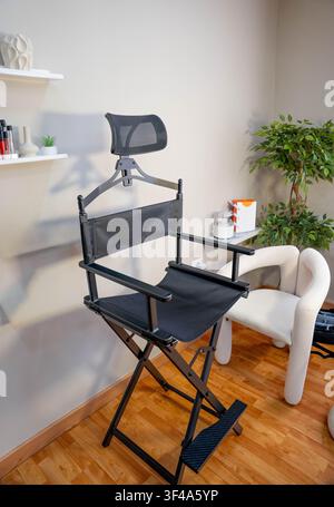 Black folding director chair with mesh backrest Stock Photo