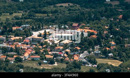 Aerial view of a rustic house nestled in a vibrant autumn landscape ...