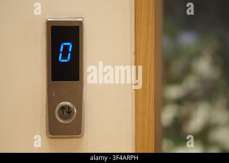 Elevator button showing the current floor number zero Stock Photo