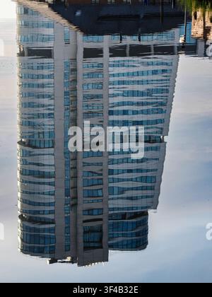 Rippled water reflection of Bridgewater Place glass tower distorted by surface ripples in Leeds Stock Photo
