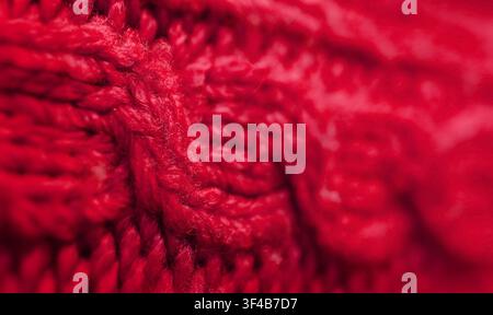 Closeup of the Pattern and Texture of Cherry Red Knitted Wool Sweater Stock Photo