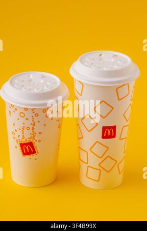 McDonalds two paper cup drink on yellow background, fast food drinks. White beverage cup for Coca-Cola, juice or cocktail. Kyiv, Ukraine - May 24, 2026. Stock Photo