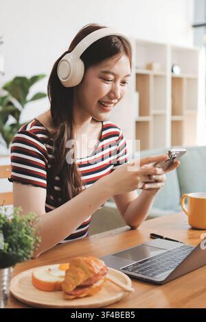 Asian woman using computer remote for business studying, watching online virtual webinar training meeting, video call. asian business woman talking on Stock Photo