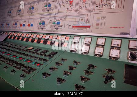Vintage Agelectric industrial control console with analog meters, synoptic diagram, and switch buttons in Catalonia, Spain. Stock Photo