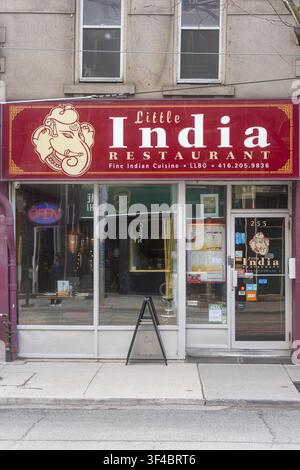 Colorful Indian Restaurant Storefront Toronto Street Red Sign Reading Little India Above Glass Doors Sandwich Board Menu on Sidewalk Neon Stock Photo