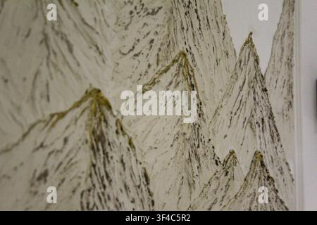 Close-up of an abstract mountain ink painting with textured brush strokes in monochrome tones, ideal as an artistic background. Stock Photo