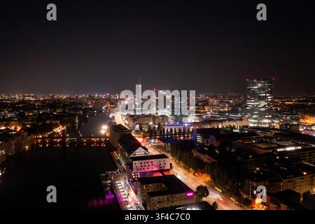 Aerial view of the Berlin skyline at night, featuring the illuminated ...