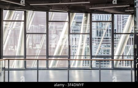 Abstract contemporary architecture or modern interior photograph. Geometric shapes and patterns formed by windows and railing on contemporary hallway. Stock Photo