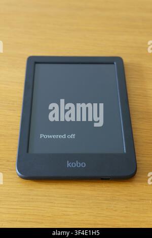 Kobo e-reader device powered off lying on a wooden surface in Fatima, Portugal Stock Photo